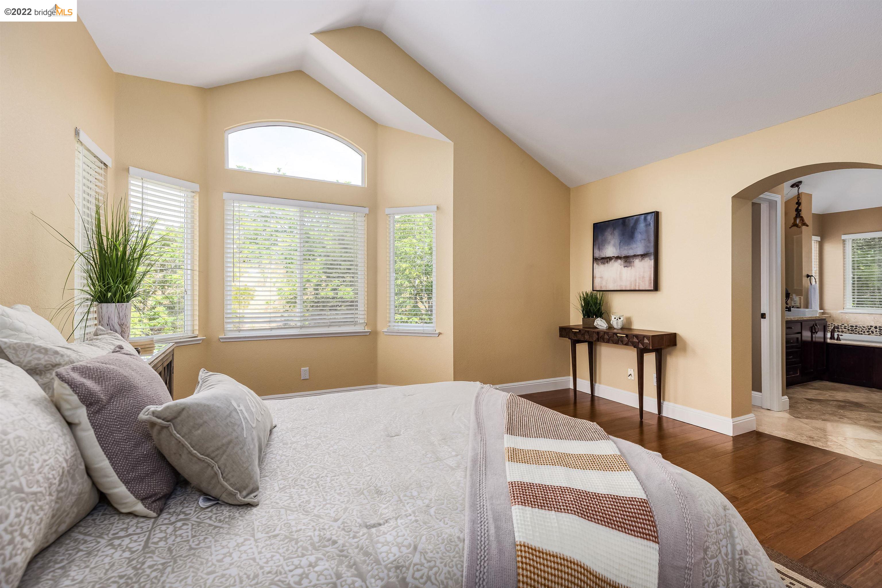 Undisclosed Address Concord, CA 94521 - Photo 23 of 47 a bedroom with a bed and large windows