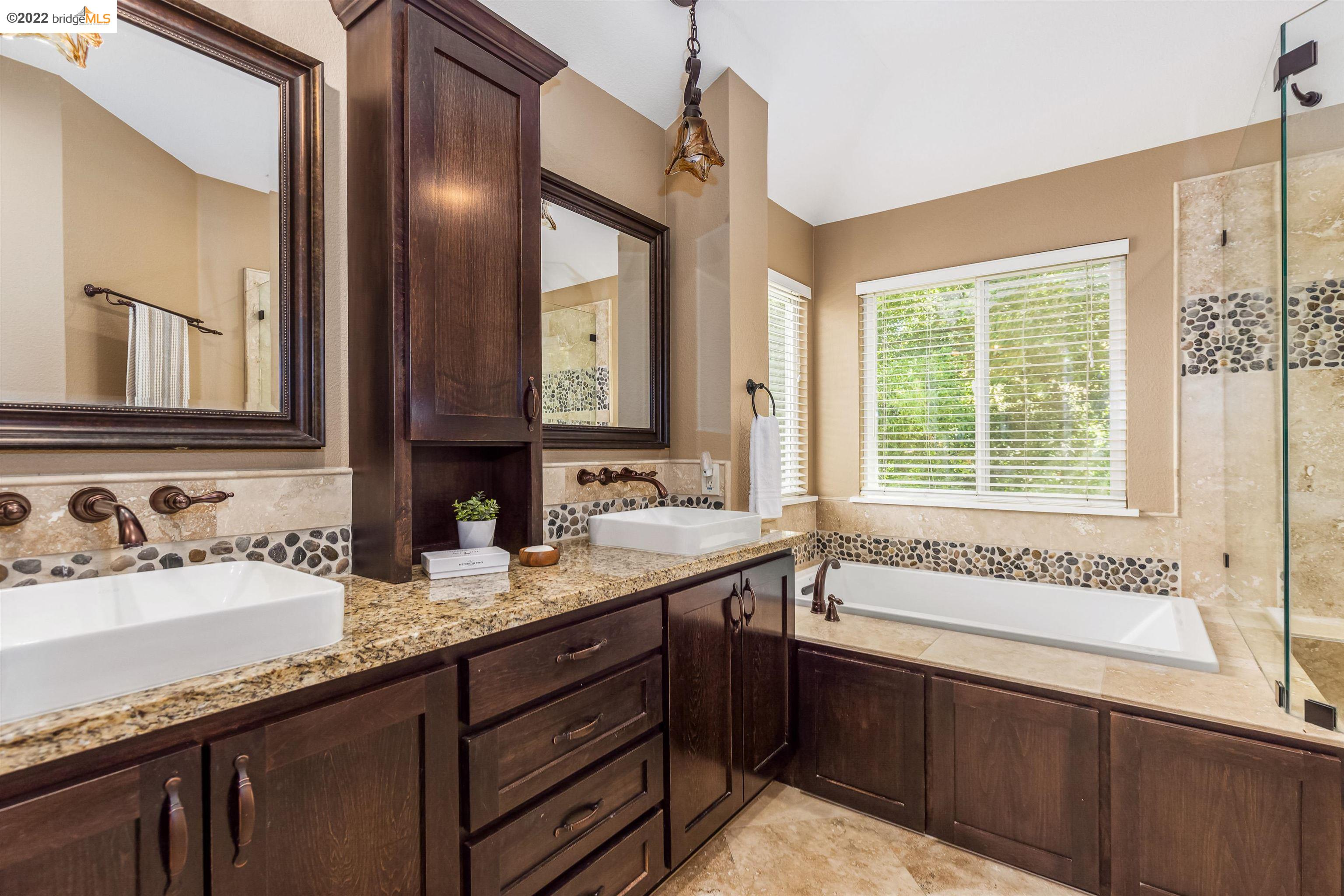 Undisclosed Address Concord, CA 94521 - Photo 24 of 47 a bathroom with a granite countertop sink and a bathtub
