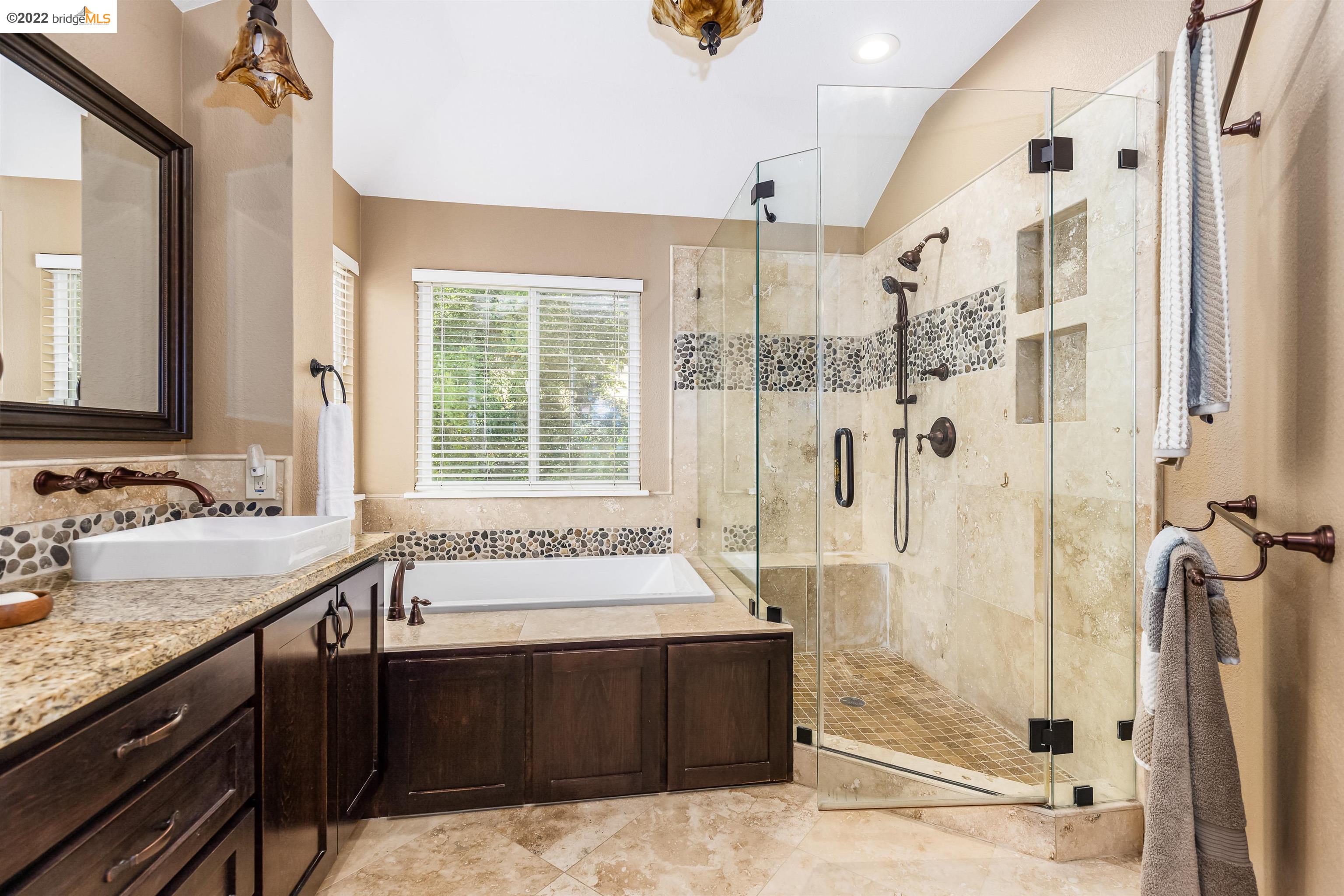 Undisclosed Address Concord, CA 94521 - Photo 25 of 47 a spacious bathroom with a tub sink shower and mirror