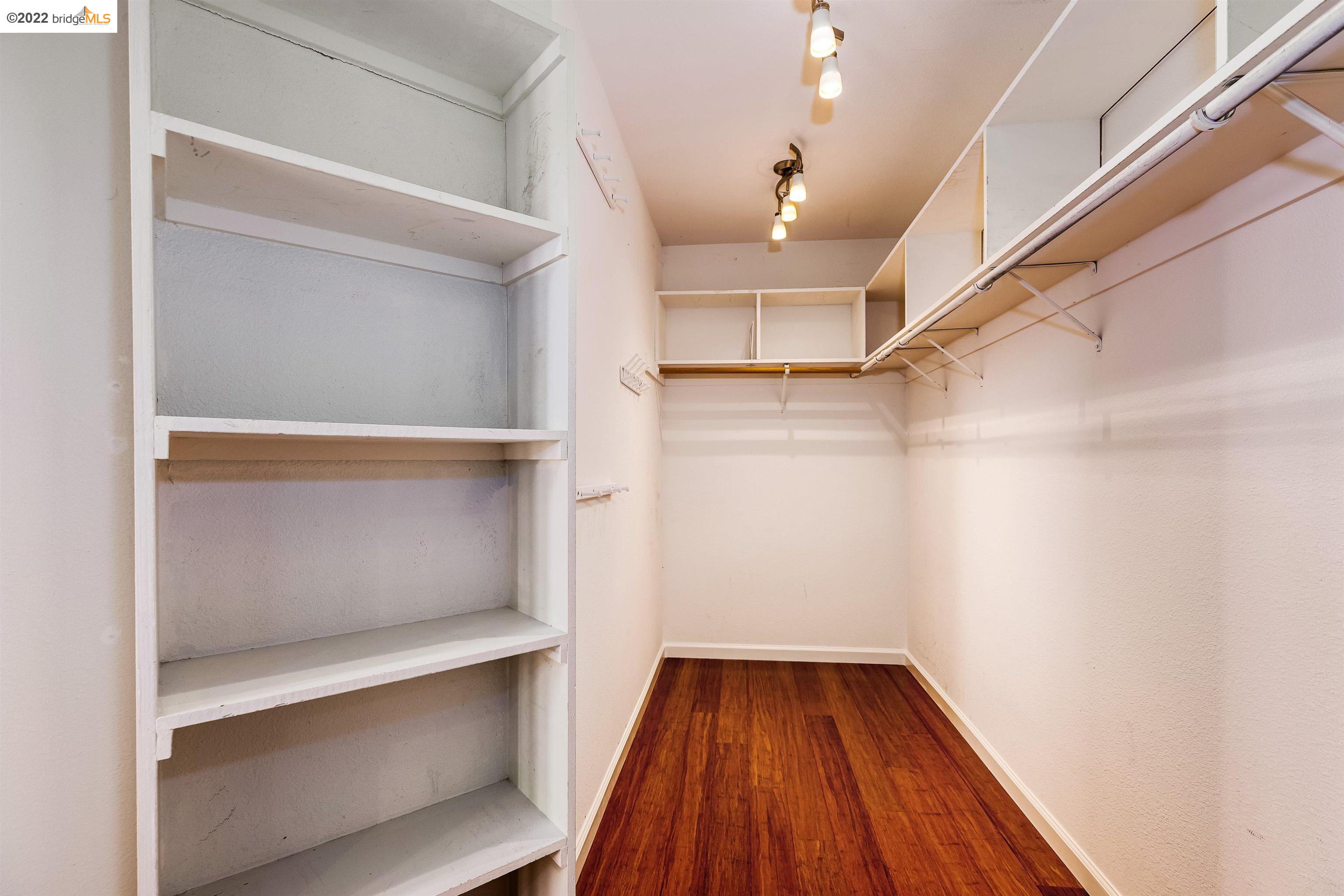 Undisclosed Address Concord, CA 94521 - Photo 26 of 47 a view of walk in closet with empty racks
