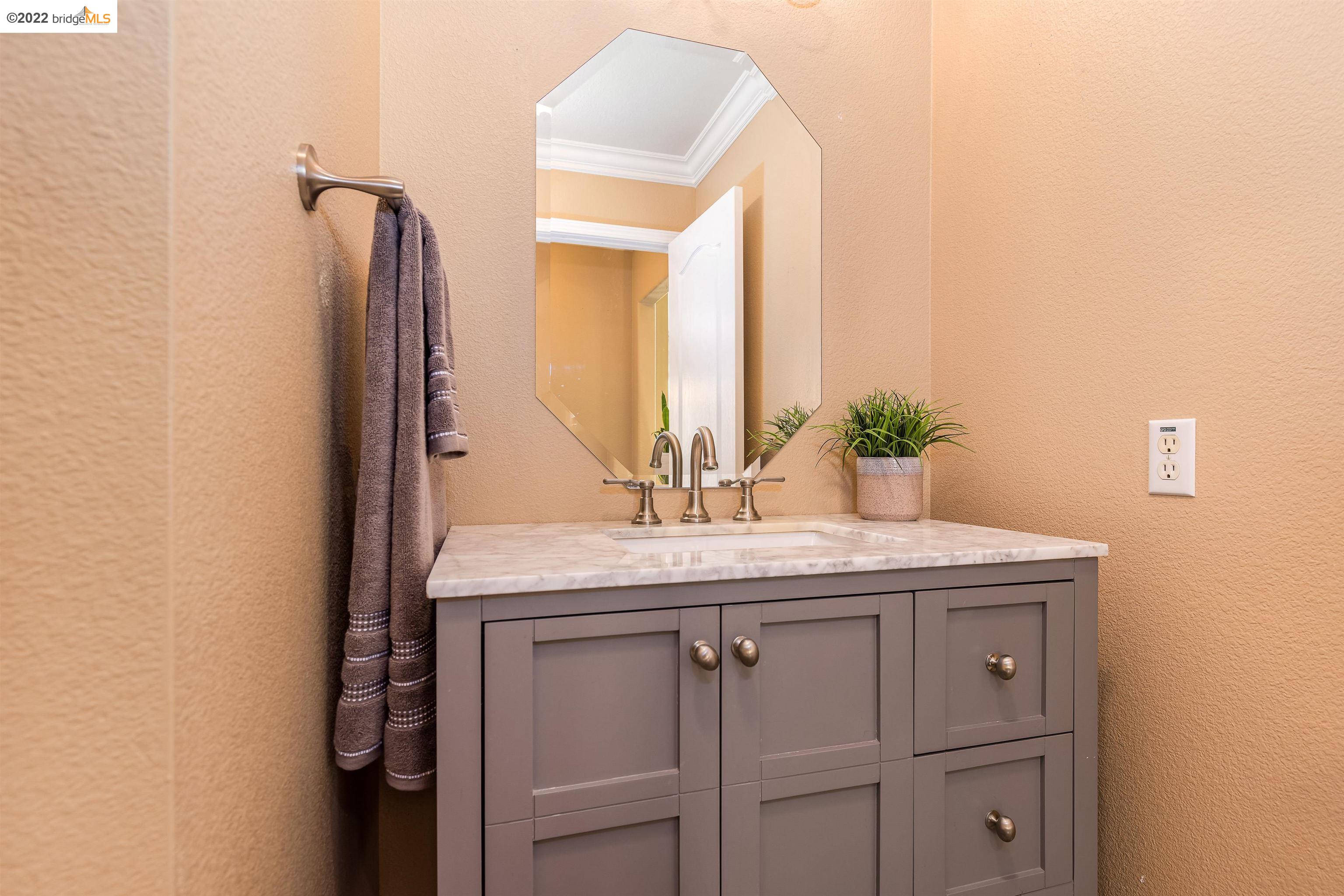 Undisclosed Address Concord, CA 94521 - Photo 30 of 47 a bathroom with a granite countertop sink and a mirror