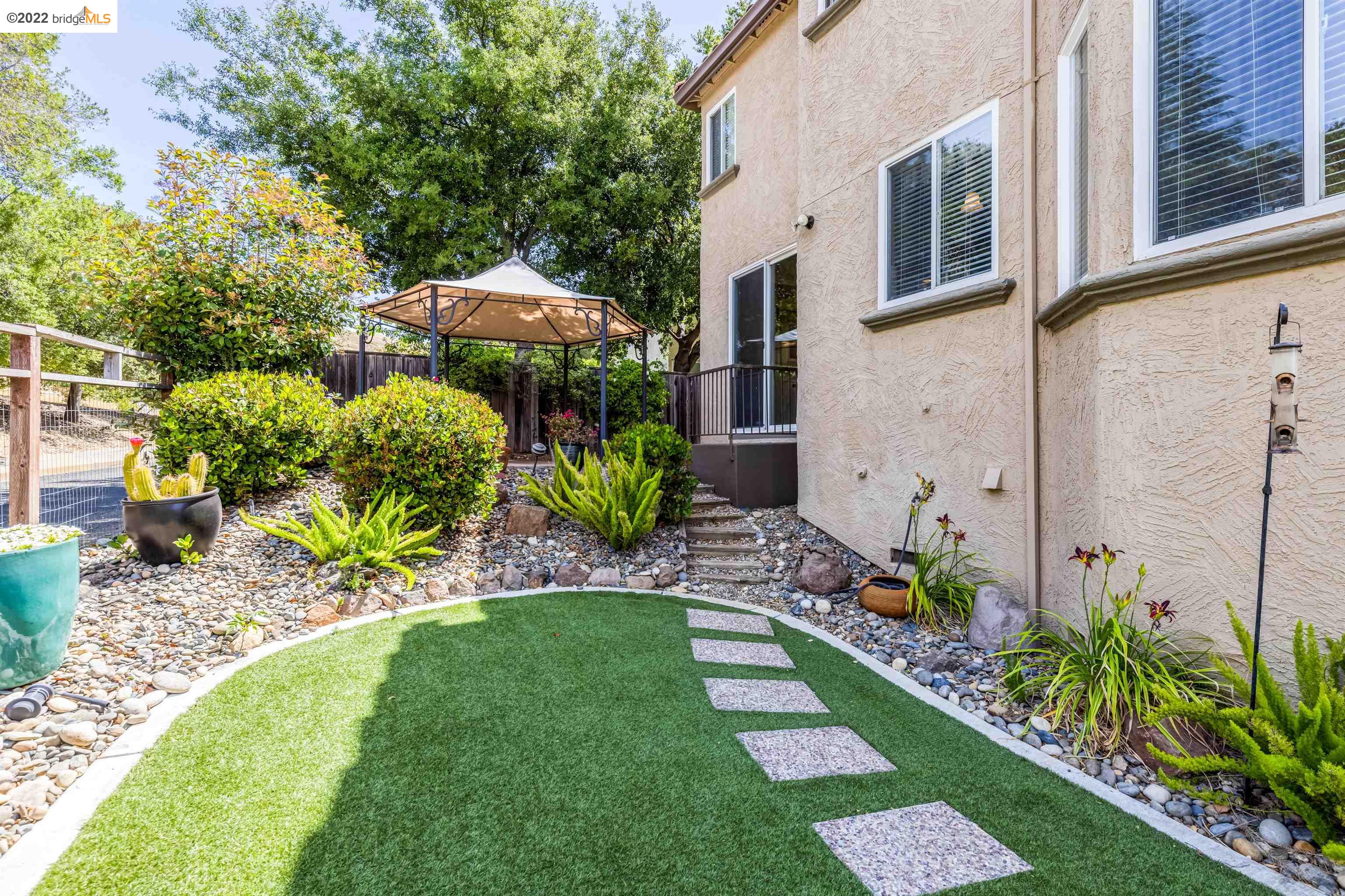 Undisclosed Address Concord, CA 94521 - Photo 33 of 47 a view of a backyard with potted plants