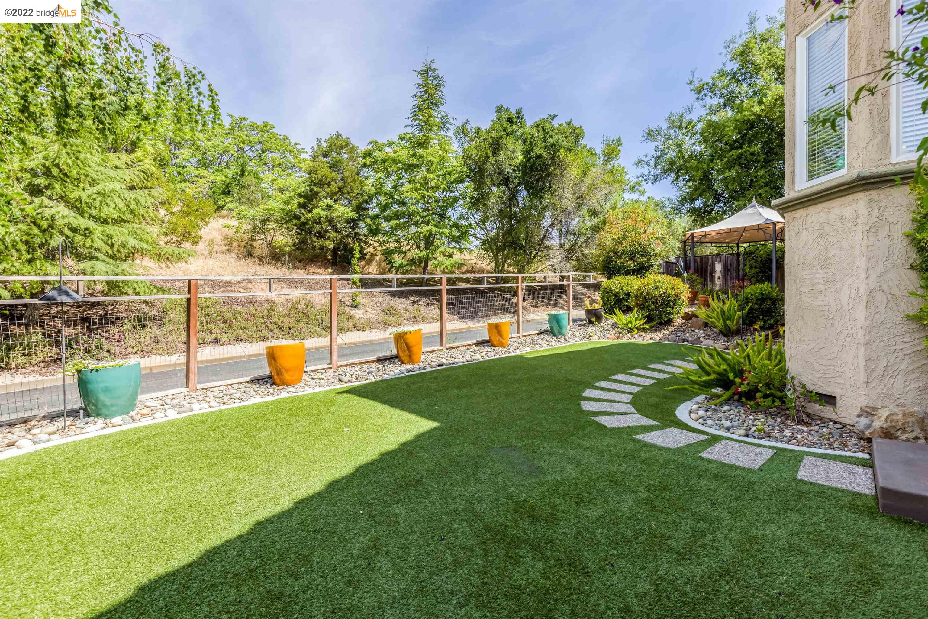 Undisclosed Address Concord, CA 94521 - Photo 34 of 47 a view of a garden and swimming pool