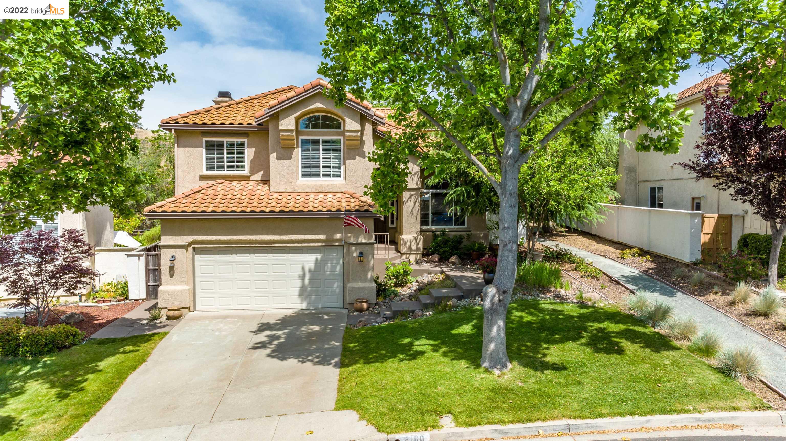 Undisclosed Address Concord, CA 94521 - Photo 38 of 47 a front view of a house with a yard and garage