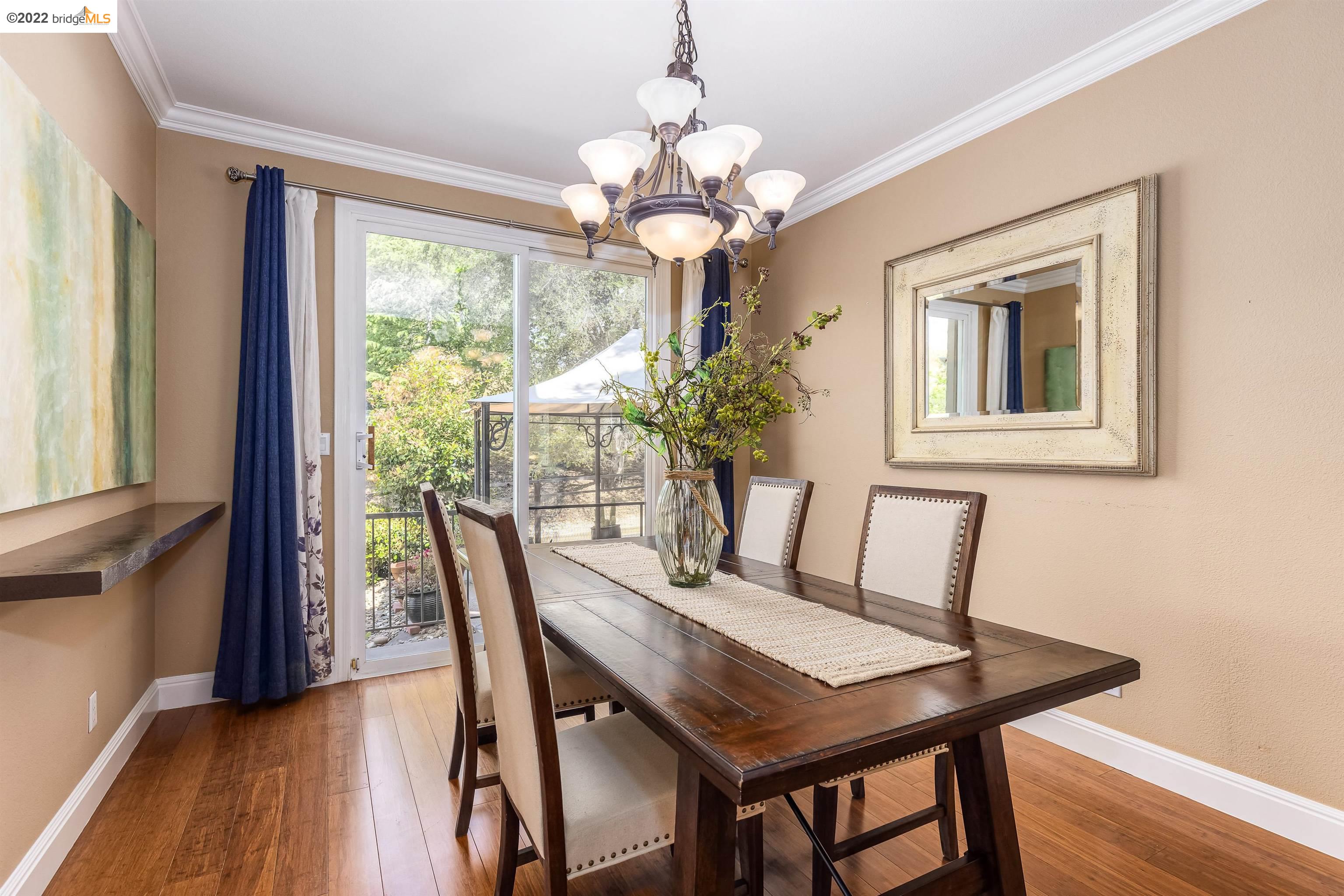 Undisclosed Address Concord, CA 94521 - Photo 10 of 47 a view of a dining room with furniture window and wooden floor