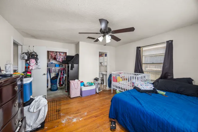 a bedroom with furniture and a window