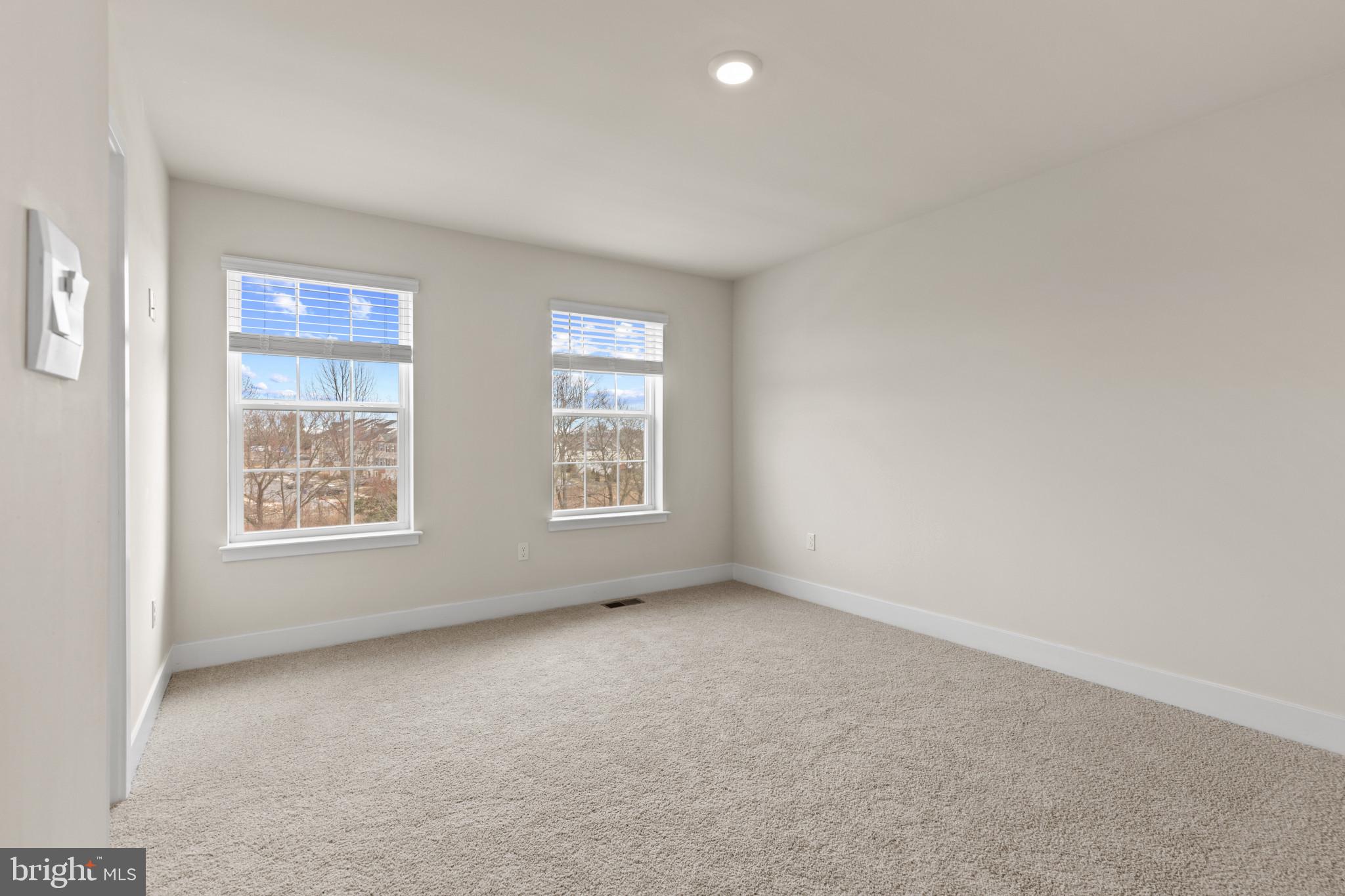 338 Hackley Drive Joppa, MD 21085 - Photo 25 of 32 an empty room with windows