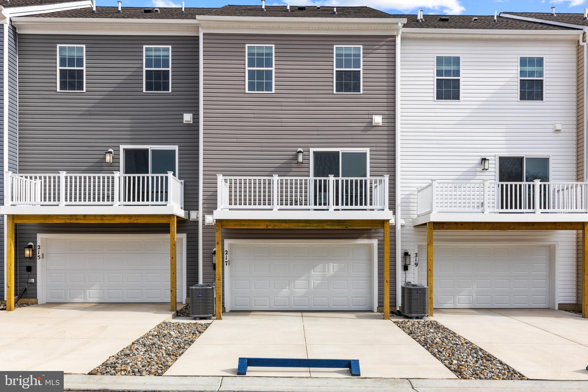 338 Hackley Drive Joppa, MD 21085 - Photo 30 of 32 a front view of a house with a yard