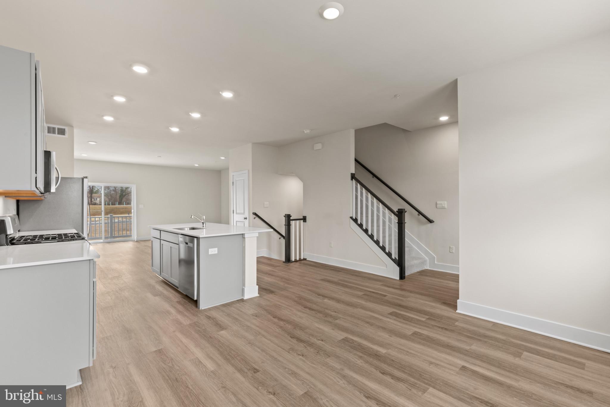 338 Hackley Drive Joppa, MD 21085 - Photo 9 of 32 a view of kitchen with furniture and wooden floor
