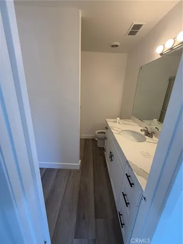 a bathroom with a sink a vanity and a mirror