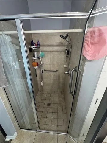 a bathroom with a toilet and a shower