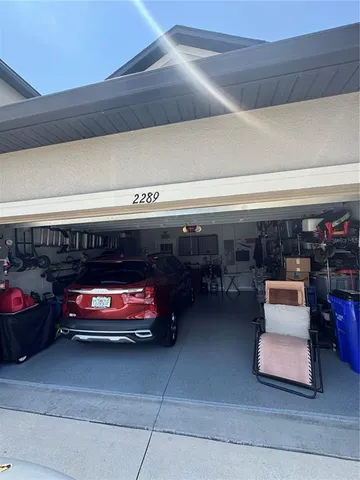 a view of a house with backyard and porch