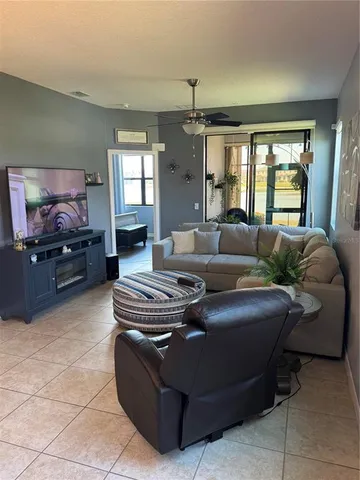 a view of a livingroom with furniture and a potted plant