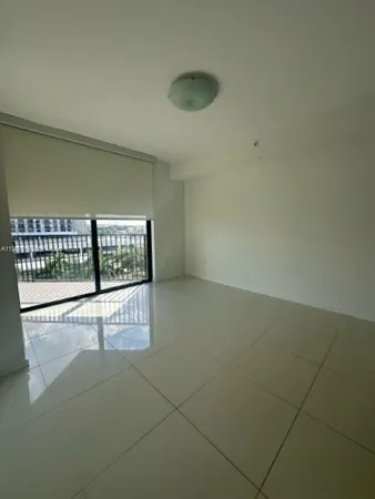 a view of an empty room and window