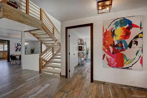 a view of an entryway with wooden floor