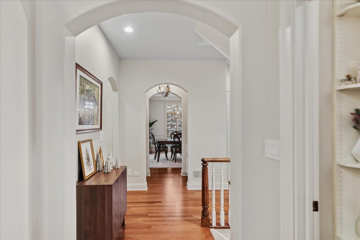 14840 Creekside Path Green Oaks, IL 60048 - Photo 16 of 35 a view of a hallway with wooden floor and dining room