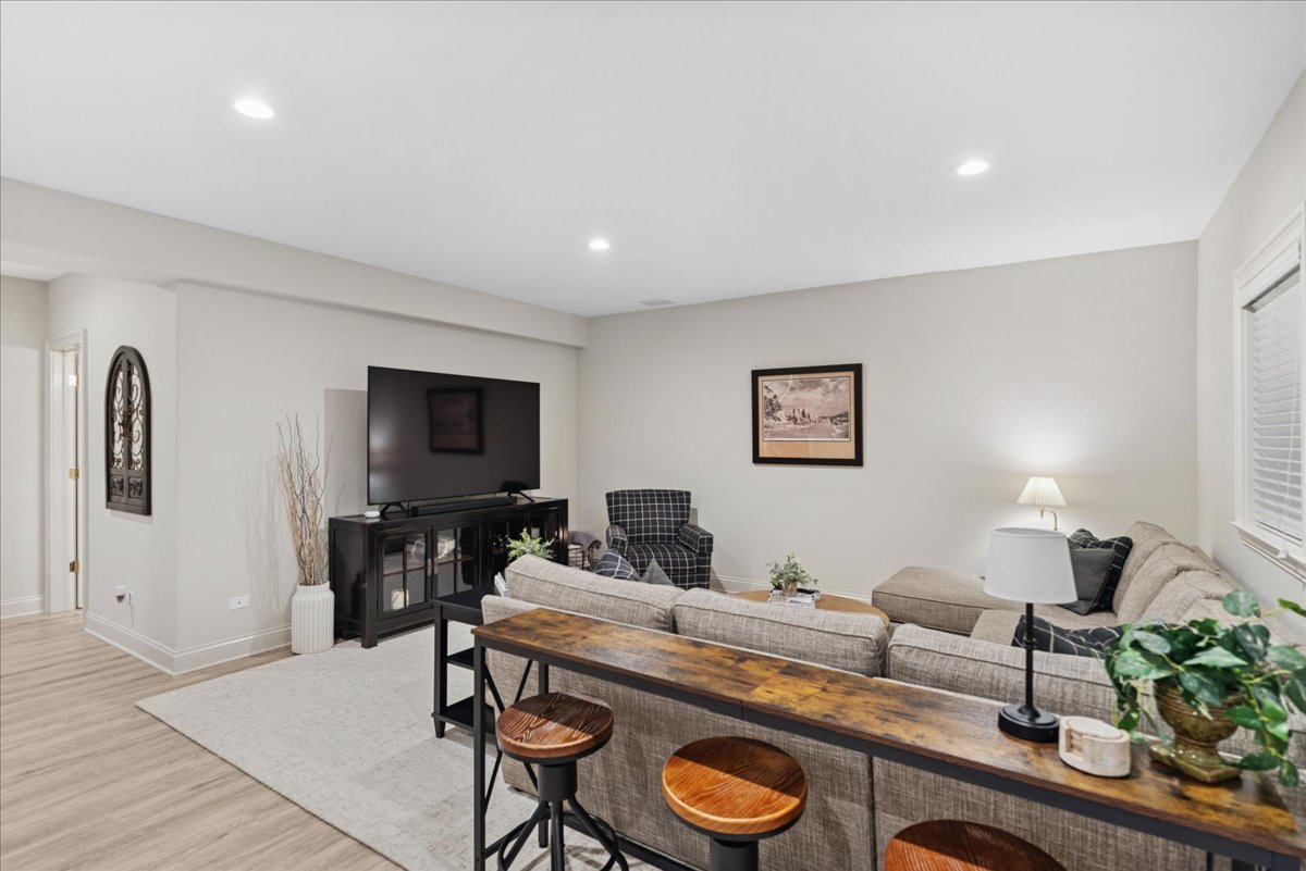 14840 Creekside Path Green Oaks, IL 60048 - Photo 26 of 35 a living room with furniture and a flat screen tv