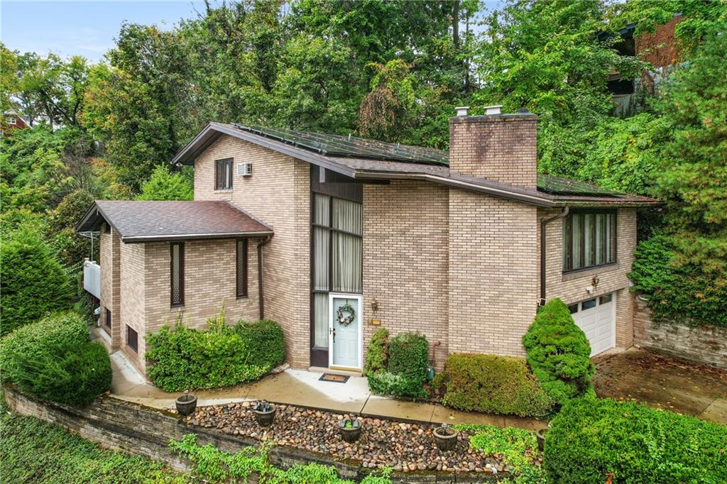 500 Allenby Avenue Pittsburgh, PA 15218 - Photo 1 of 35 a front view of a house with garden