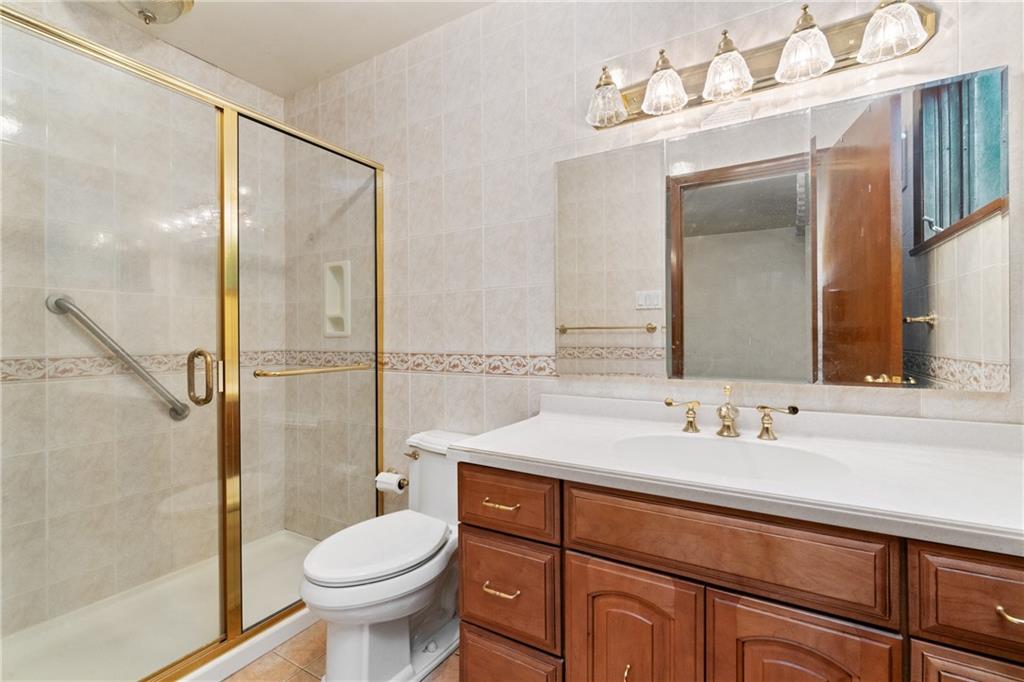 500 Allenby Avenue Pittsburgh, PA 15218 - Photo 11 of 35 a bathroom with a sink toilet and shower