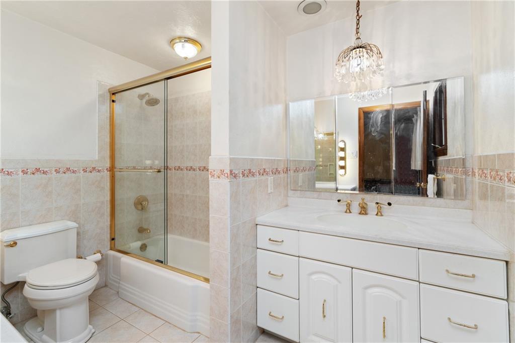 500 Allenby Avenue Pittsburgh, PA 15218 - Photo 14 of 35 a bathroom with a sink a toilet and shower