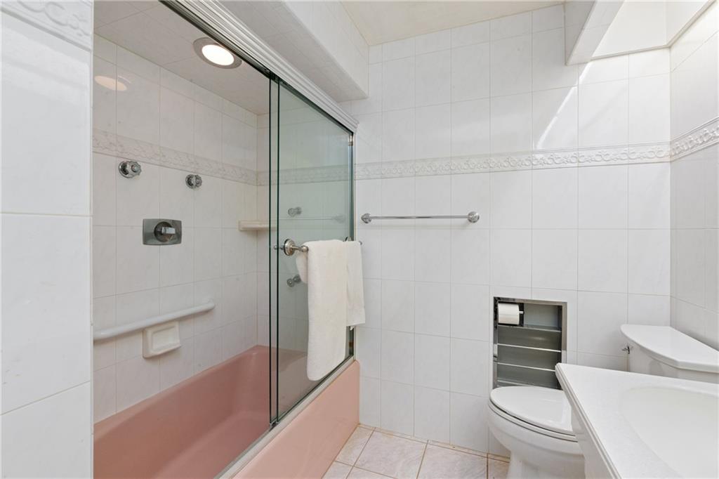 500 Allenby Avenue Pittsburgh, PA 15218 - Photo 19 of 35 a bathroom with a toilet and a shower