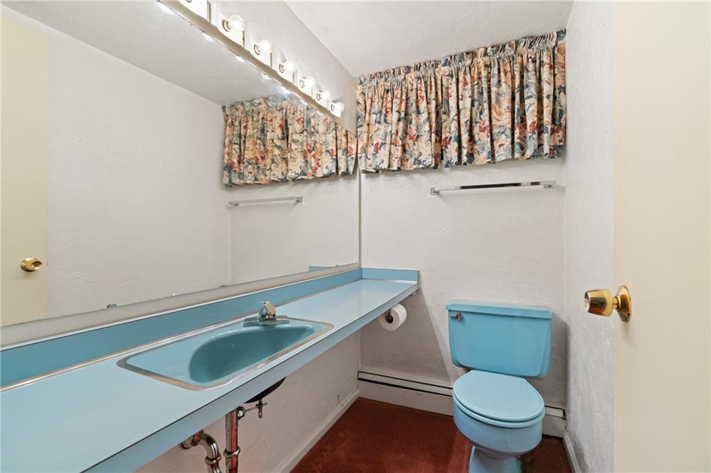 500 Allenby Avenue Pittsburgh, PA 15218 - Photo 23 of 35 a bathroom with a sink and a toilet