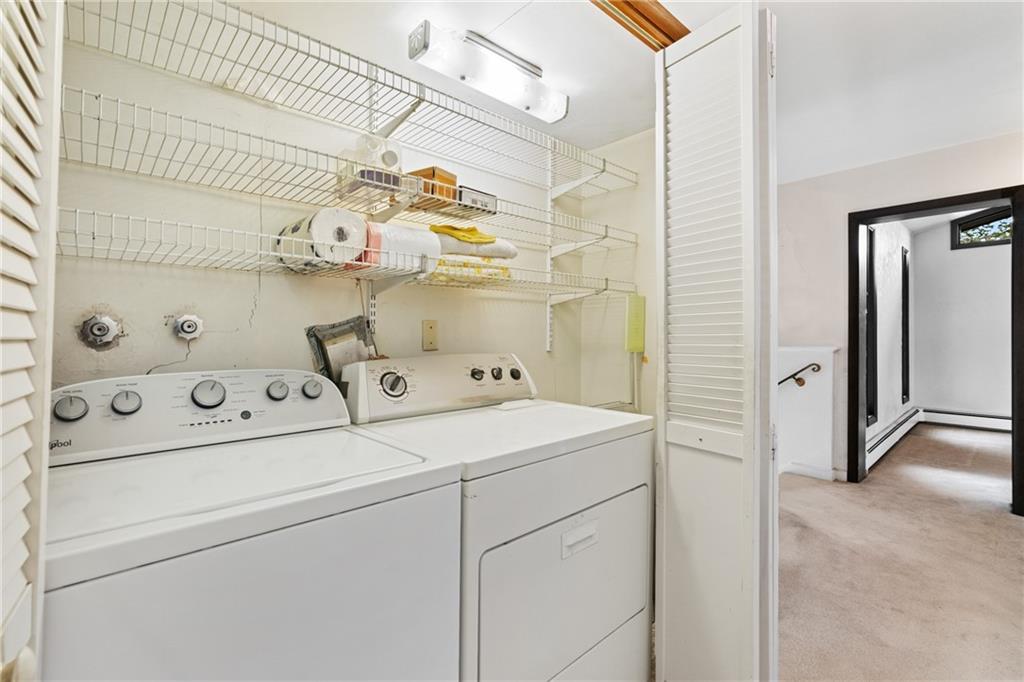 500 Allenby Avenue Pittsburgh, PA 15218 - Photo 24 of 35 a view of washer and dryer with kitchen in the background