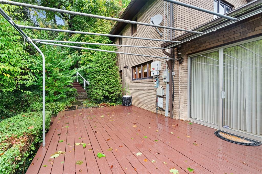 500 Allenby Avenue Pittsburgh, PA 15218 - Photo 27 of 35 a backyard of a house with lots of green space and wooden floor