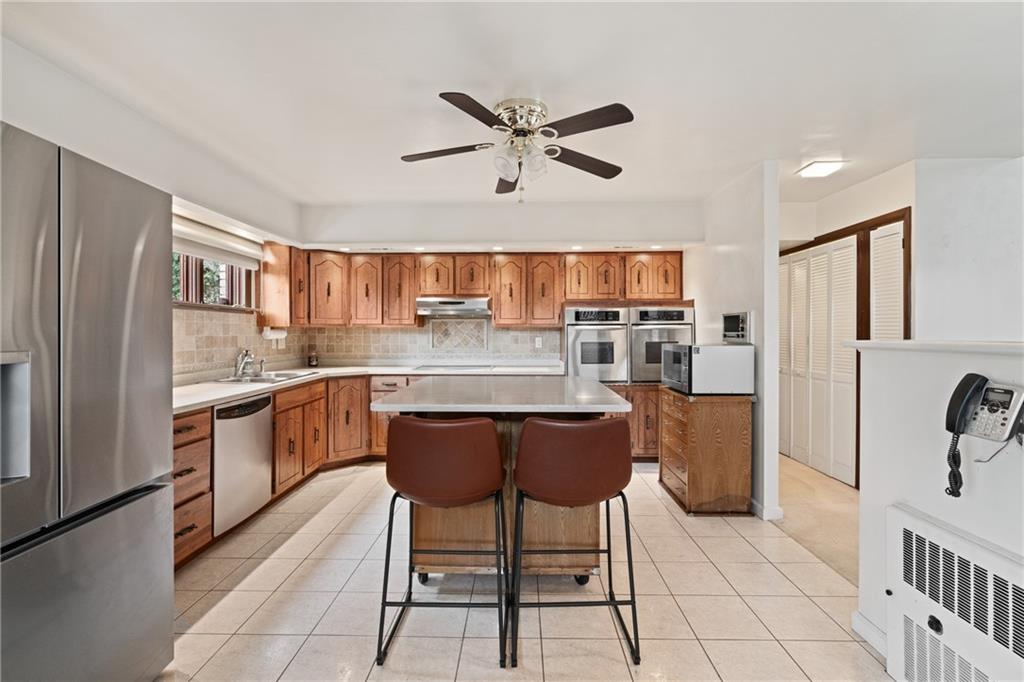 500 Allenby Avenue Pittsburgh, PA 15218 - Photo 4 of 35 a kitchen with stainless steel appliances a refrigerator and microwave