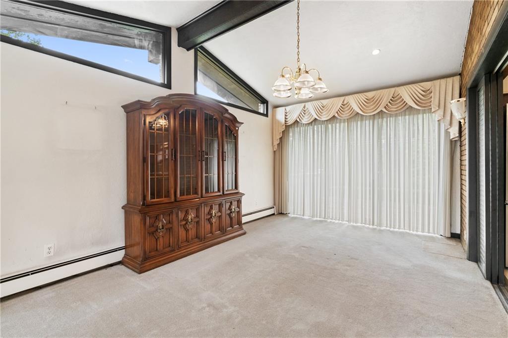 500 Allenby Avenue Pittsburgh, PA 15218 - Photo 5 of 35 a view of a hallway with a chandelier