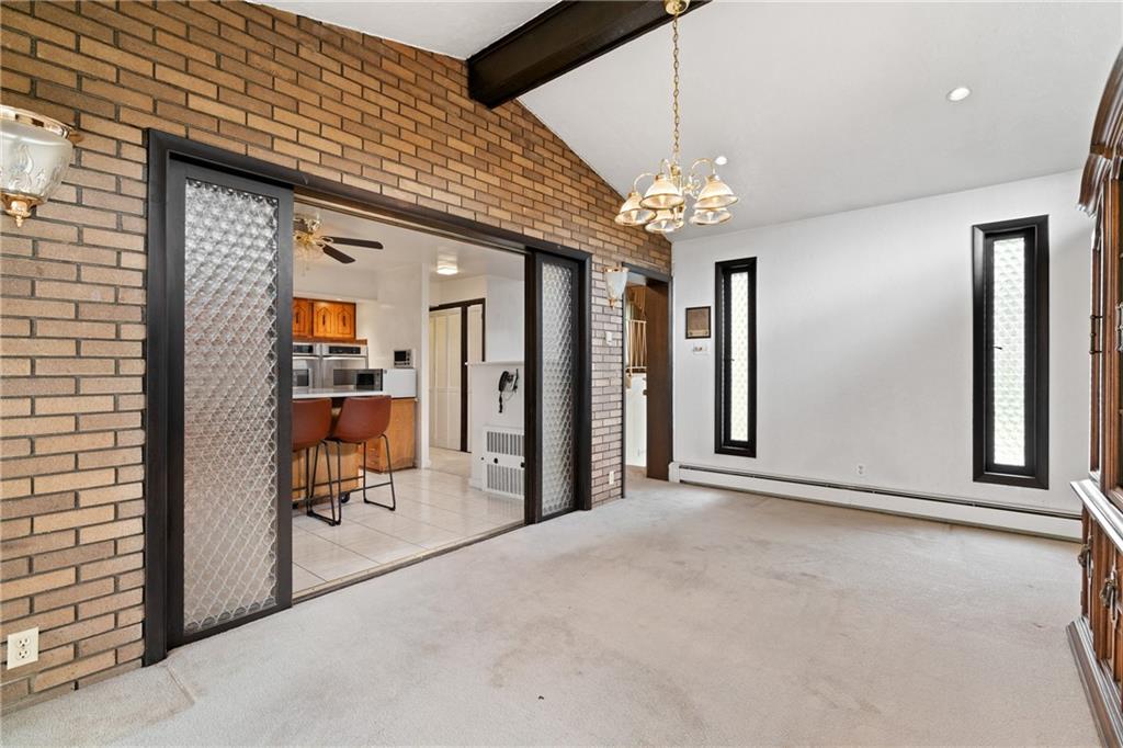 500 Allenby Avenue Pittsburgh, PA 15218 - Photo 6 of 35 a view of a livingroom with a chandelier furniture and windows