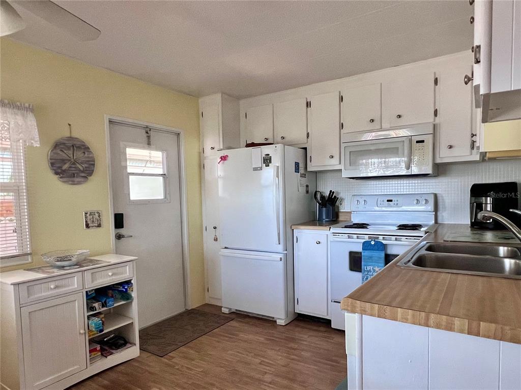 1100 South Belcher Road, Unit 260 Largo, FL 33771 - Photo 16 of 79 a kitchen with a refrigerator stove and sink