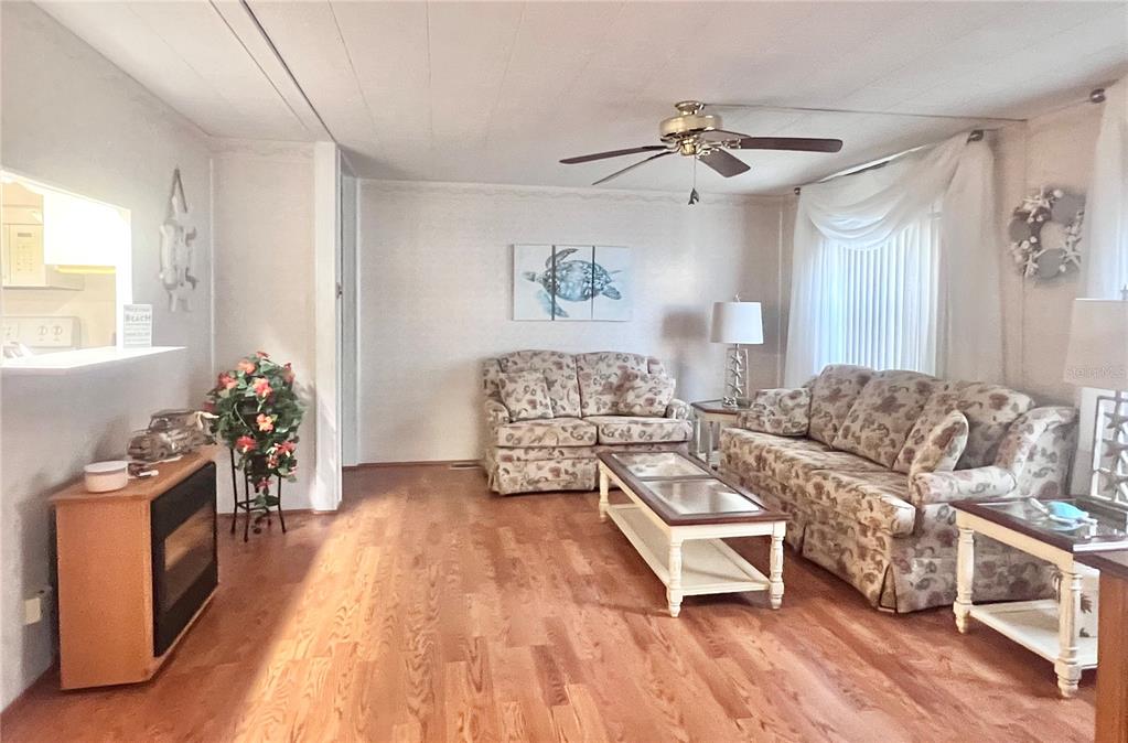 1100 South Belcher Road, Unit 260 Largo, FL 33771 - Photo 20 of 79 a living room with furniture and a wooden floor