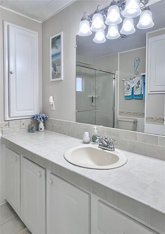 1100 South Belcher Road, Unit 260 Largo, FL 33771 - Photo 30 of 79 a bathroom with a sink vanity and a mirror