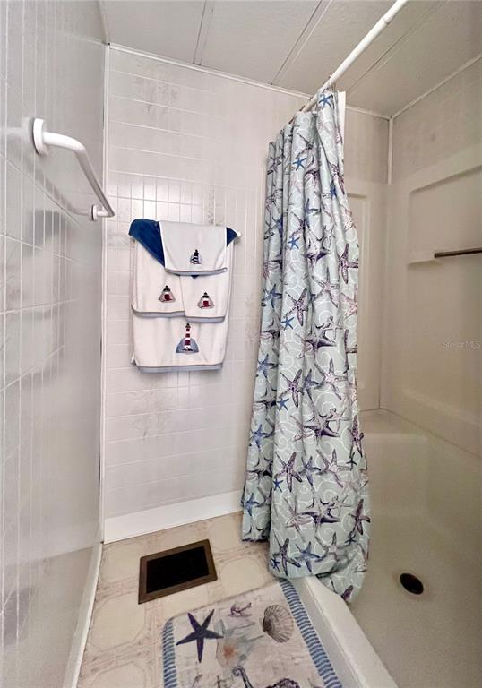 1100 South Belcher Road, Unit 260 Largo, FL 33771 - Photo 45 of 79 a bathroom with a shower curtain and a sink