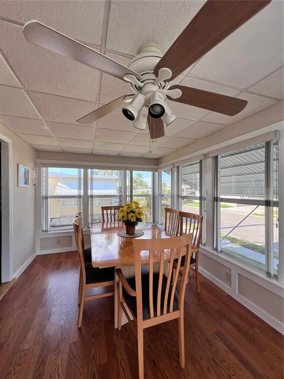 1100 South Belcher Road, Unit 260 Largo, FL 33771 - Photo 6 of 79 a view of a dining room with furniture window and wooden floor