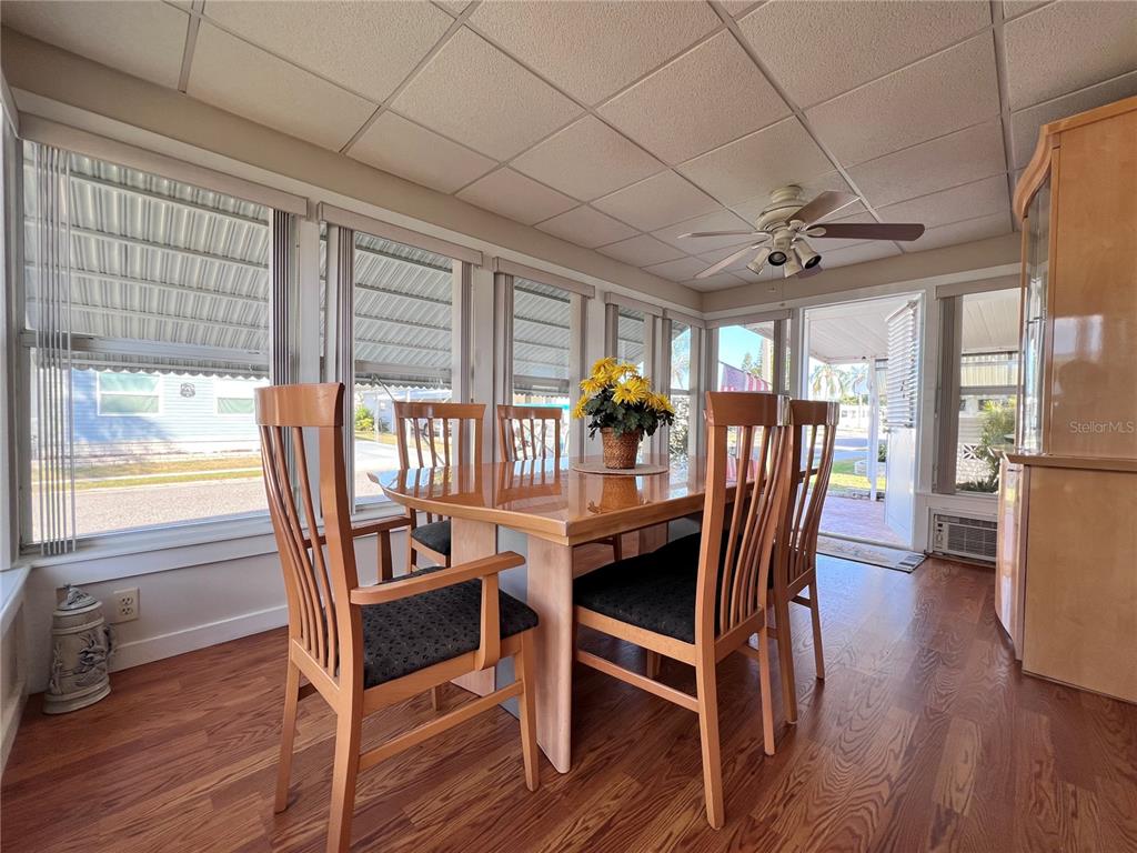 1100 South Belcher Road, Unit 260 Largo, FL 33771 - Photo 8 of 79 a view of a dining room with furniture window and wooden floor