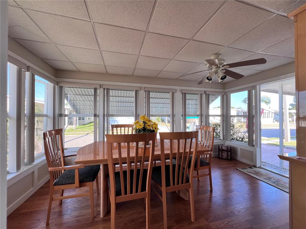 1100 South Belcher Road, Unit 260 Largo, FL 33771 - Photo 9 of 79 a view of a dining room with furniture window and wooden floor
