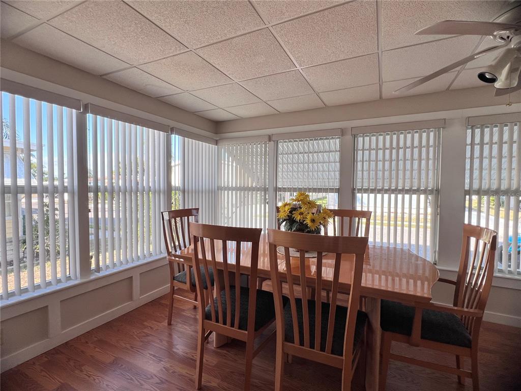 1100 South Belcher Road, Unit 260 Largo, FL 33771 - Photo 10 of 79 a view of a dining room with furniture window and wooden floor