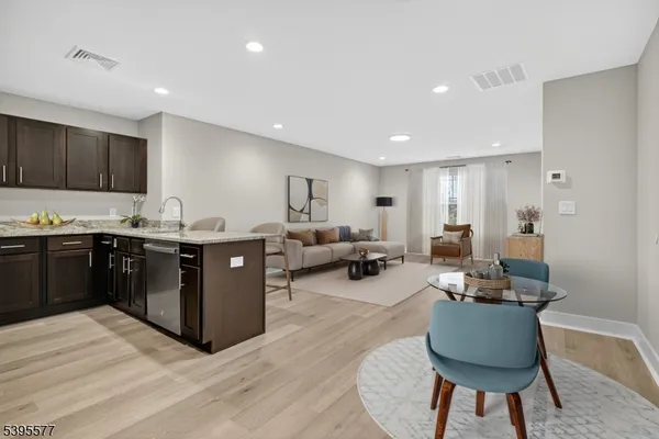 a spacious bedroom with a bed a table and chair