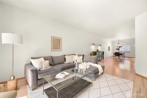 a living room with furniture and a table