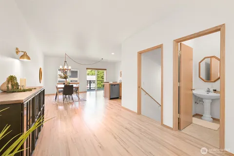 a view of a living room and a wooden floor