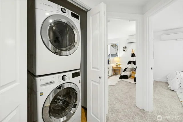 a view of a hallway with washer and dryer