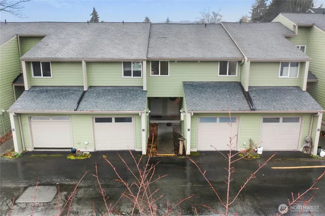 a front view of a house with parking space