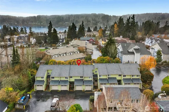 an aerial view of residential house with outdoor space and swimming pool