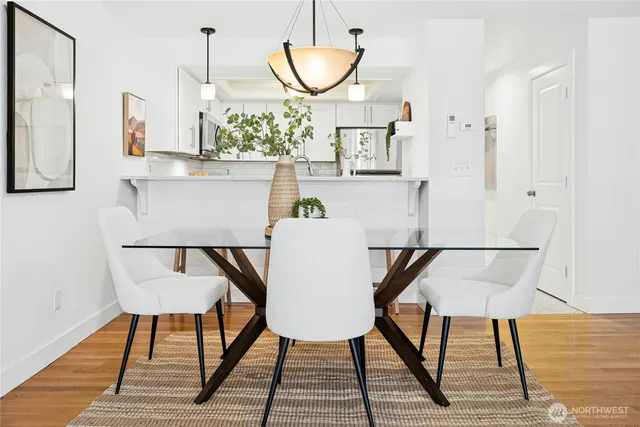 a view of a dining room with furniture and wooden floor
