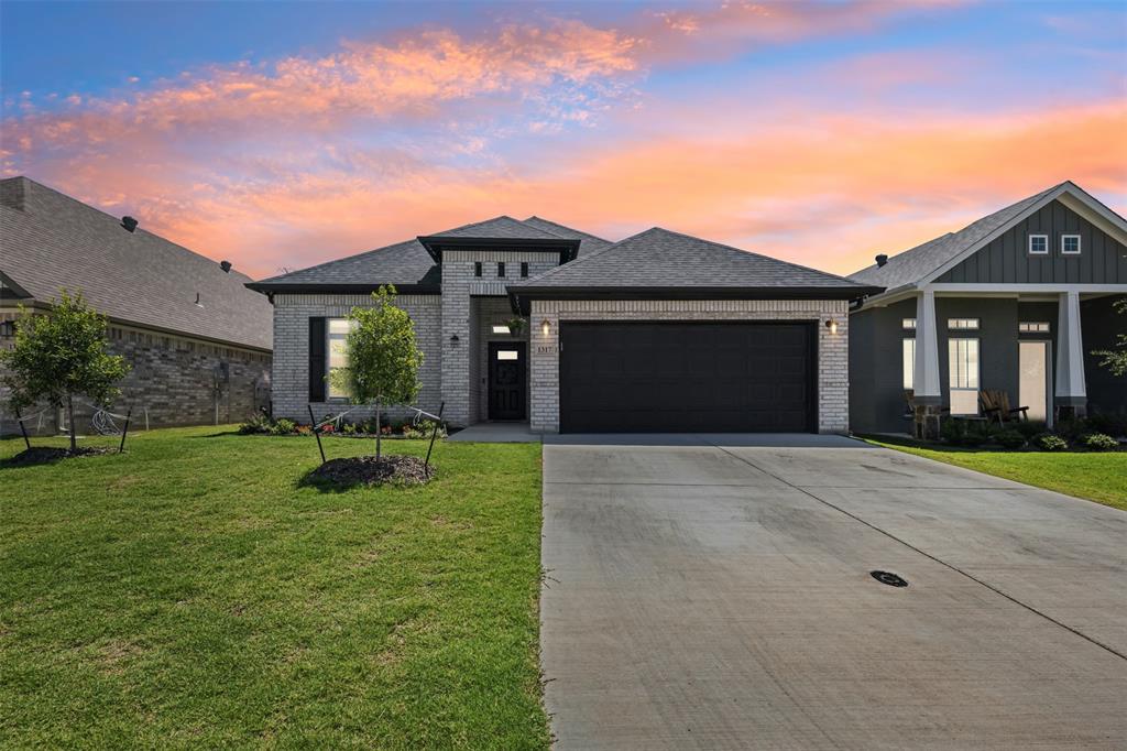 1317 Ridgeview Drive Weatherford, TX 76086 - Photo 1 of 1 front view of a house with a yard