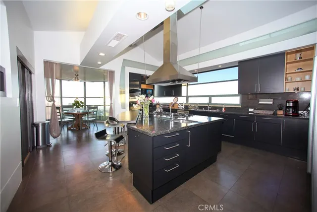 a room with lots of wooden furniture and windows
