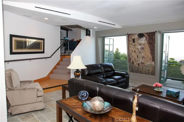 a living room with furniture and a window