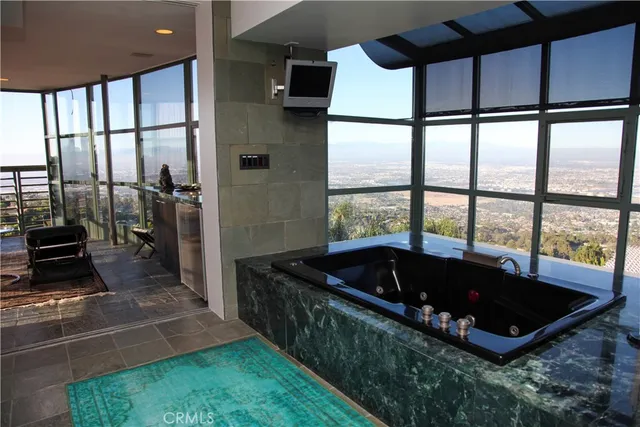 a living room with a large bed and a large window